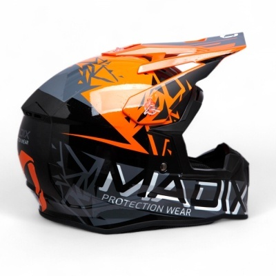 Capacete integral para motocross em plástico com padrões geométricos.