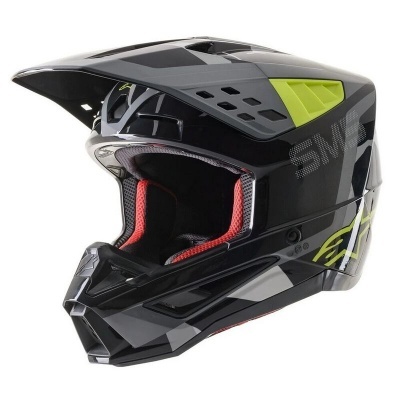 Capacete integral preto com detalhes cinza, amarelo verde e interior vermelho para motocross.