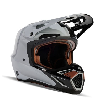 Capacete integral motocross branco e preto com interior acolchoado castanho e viseira ajustável.