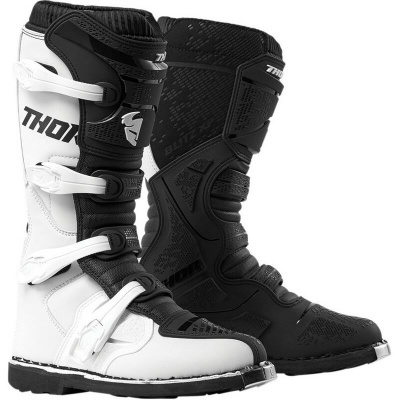 Botas de motocross THOR preta e branca com fivelas ajustáveis.