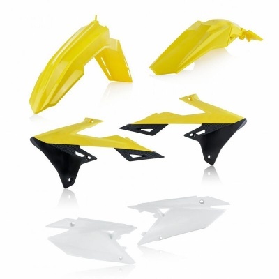 Peças plásticas para moto em amarelo, preto e branco sobre fundo branco