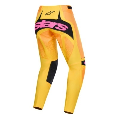 Calças técnicas amarelas com textos e padrões coloridos e logótipo Alpinestars