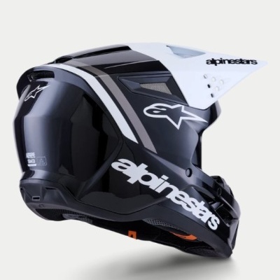 Capacete de motocross preto com detalhes brancos e cinzentos com o logótipo alpinestars.