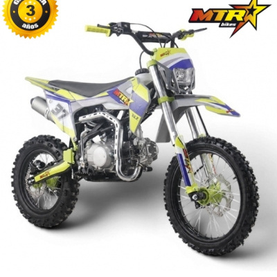 Motocicleta de motocross preta com detalhes amarelos e azuis, pneus todo-o-terreno e texto de garantia.