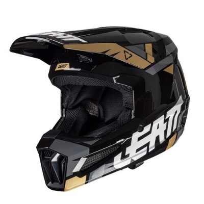 Capacete de motocross preto com detalhes dourados e texto LEATT