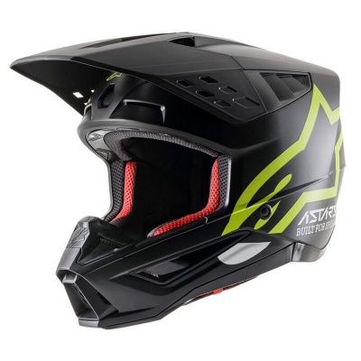Capacete integral motocross preto com detalhes verdes e interior vermelho