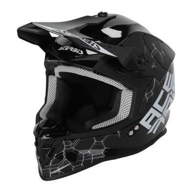Capacete de motocross preto com padrões hexagonais e texto AREAS