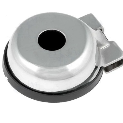 Peça metálica redonda com base preta e abertura circular no centro