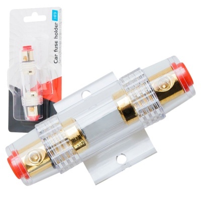 Suporte de fusível para carro com plástico transparente e detalhes dourados, nas extremidades vermelhas, e embalagem com texto.