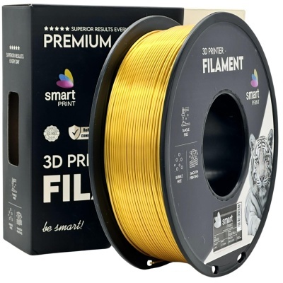 Filamento dourado para impressora 3D em bobina preta e embalagem preta com etiquetas.