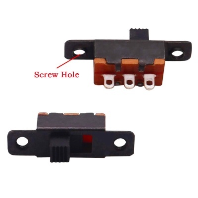 Interruptores deslizantes eletrónicos preto e castanho com orifícios para parafusos e três pinos