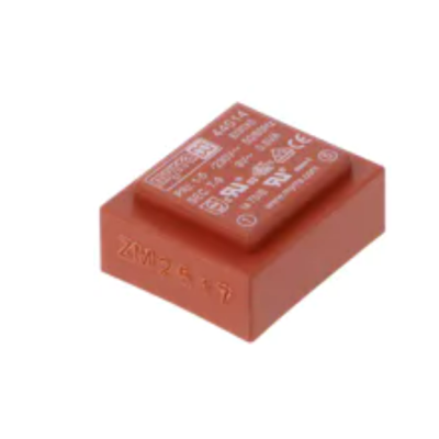 Transformador encarnado com texto técnico branco na superfície superior.