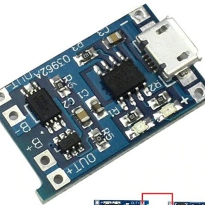 Placa eletrónica azul com componentes e porta micro USB branca, texto OJ39-24-01 TE e indicações de polaridade