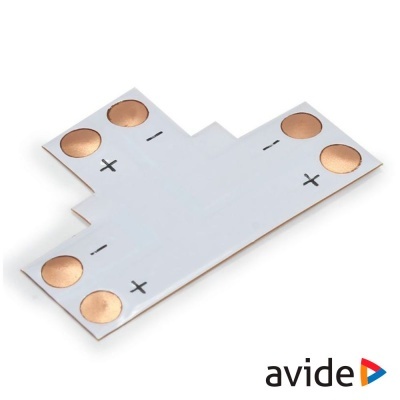 Placa eletrónica em forma de T com contactos de cobre e sinais de polaridade.