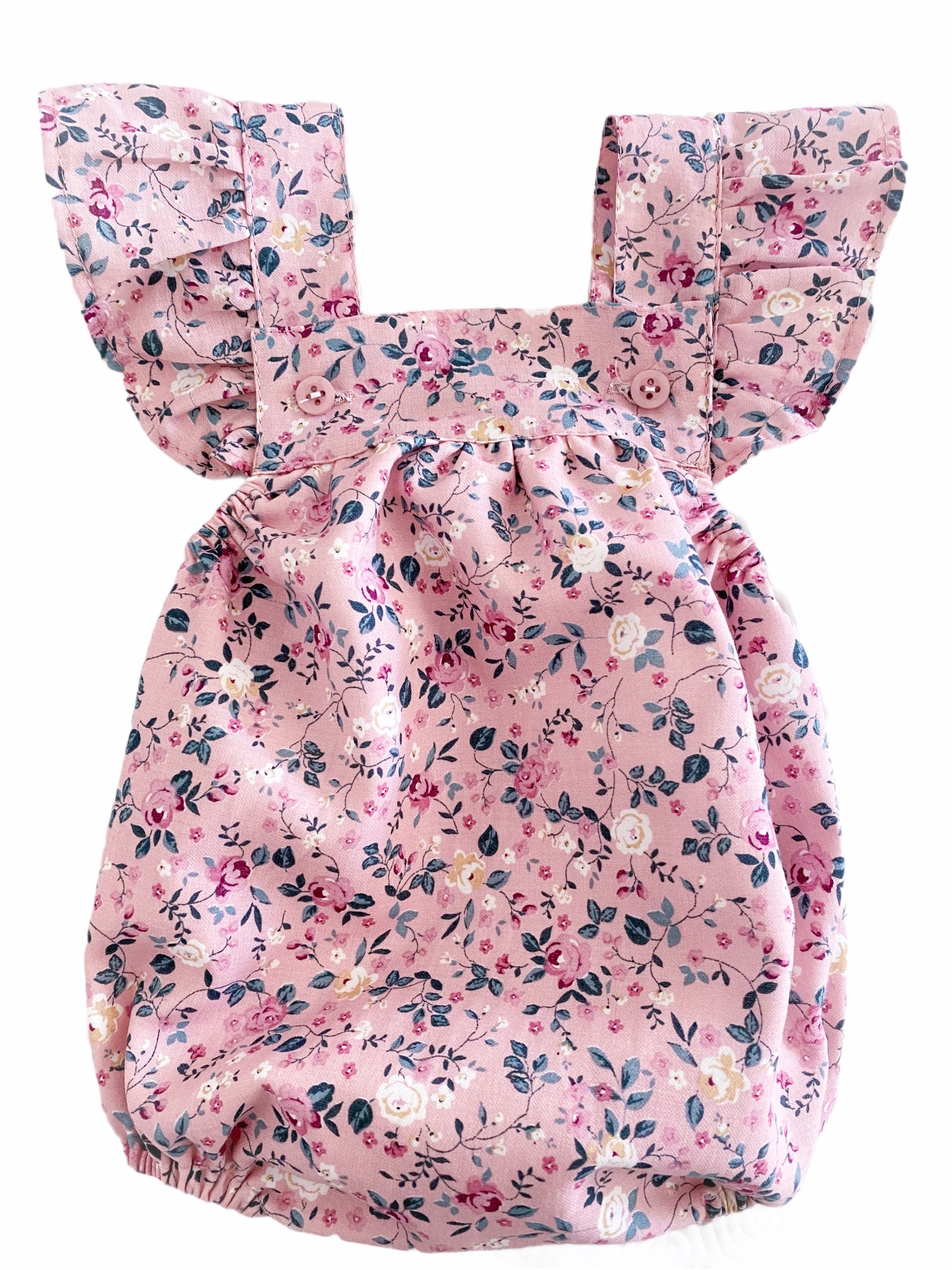 Macacão rosa para bebé com padrão floral e alças com folhos