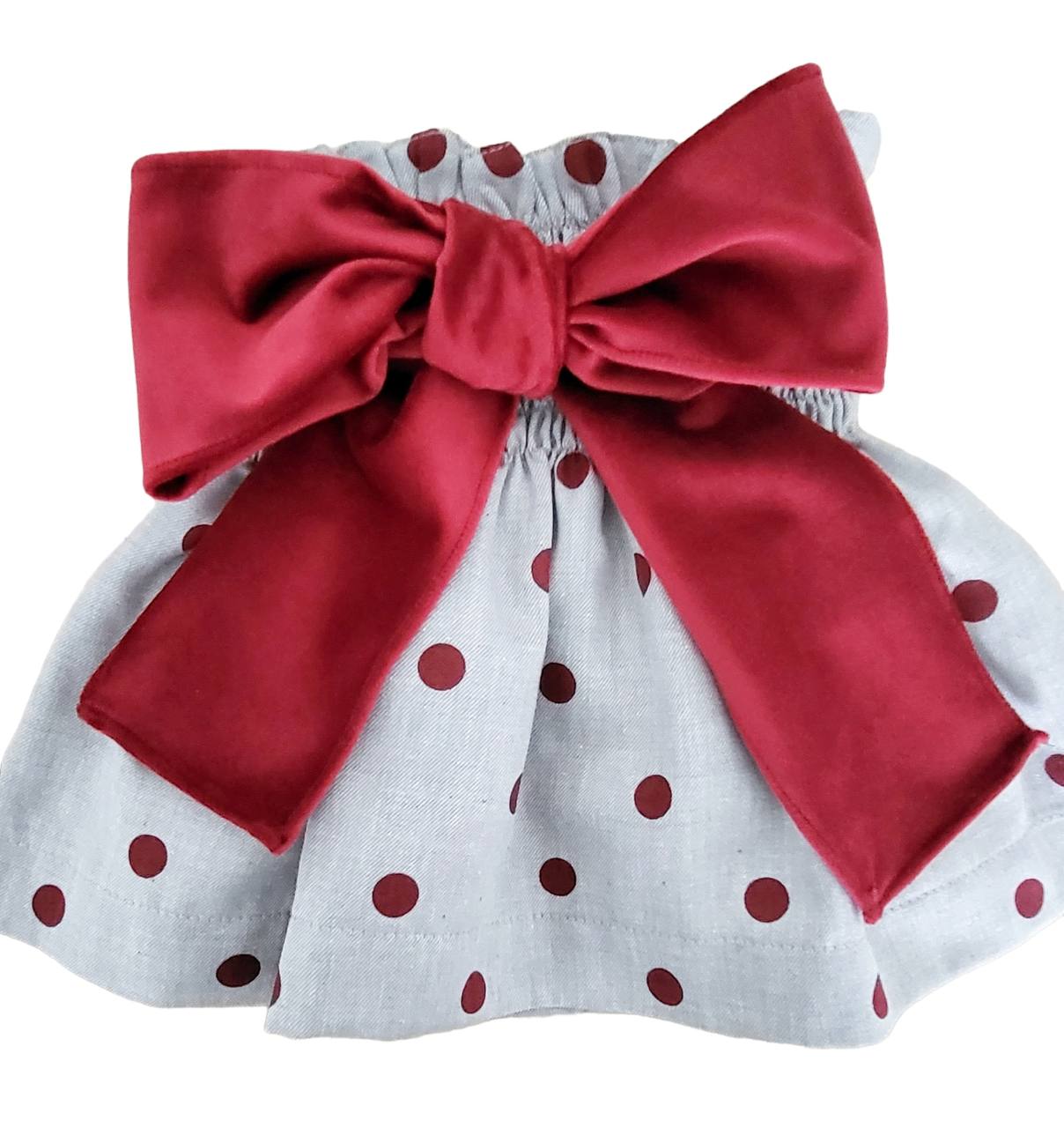 Saia Infantil com padrão de bolinhas vermelhas e laço vermelho grande