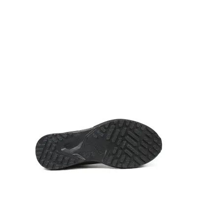 Sola preta antiderrapante de sapato com texto VIBRAM