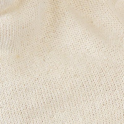 Pano tecido em malha bege clara com textura suave