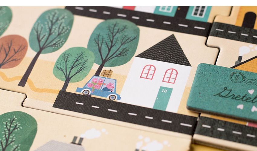 Jogo O Carteiro Quebra-cabeças de madeira com ilustração de casa, árvores, carro e texto 'Dretel'