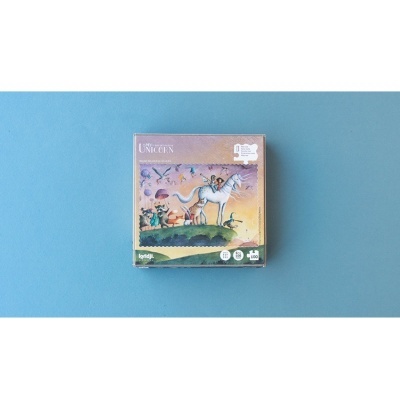 Caixa de puzzle The Last Unicorn com ilustrações e fundo azul