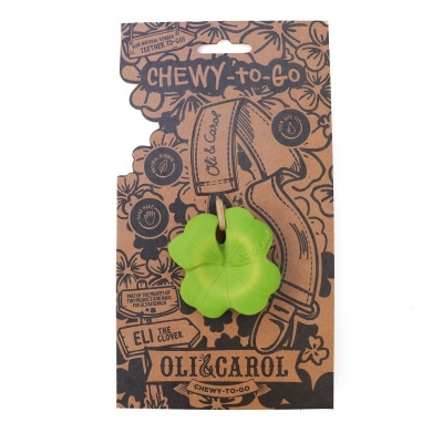 Brinquedo pet verde em forma de trevo em embalagem de cartão castanho com texto