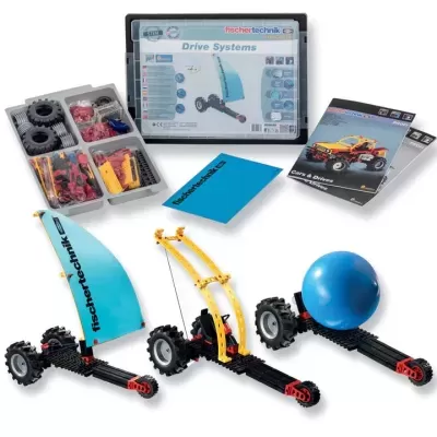Conjunto educativo fischertechnik Drive Systems com peças de construção e manuais.