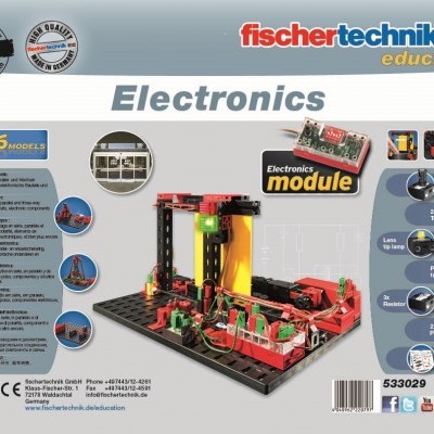 Kit educativo fischertechnik Electronics com modelo eletrônico colorido e texto multilíngue na embalagem.