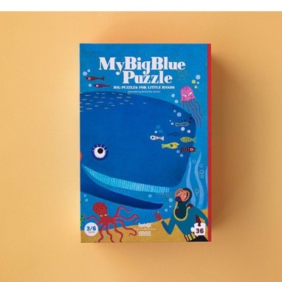 Caixa azul de puzzle infantil com baleia e peixes coloridos