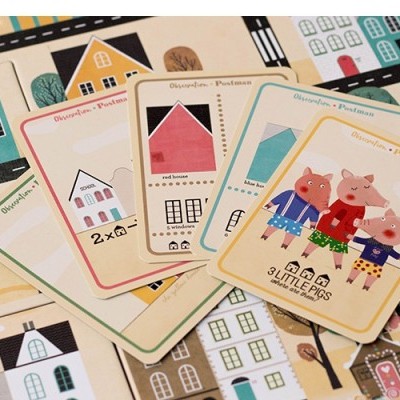 Cartas infantis coloridas com personagens de porquinhos e casas sobre fundo estampado de casas