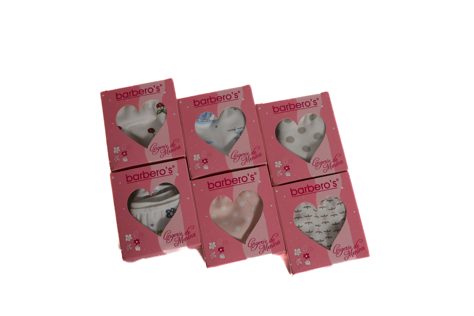 Seis caixas rosa de lingerie para menina da marca barberos com janelas em forma de coração mostrando diferentes padrões.