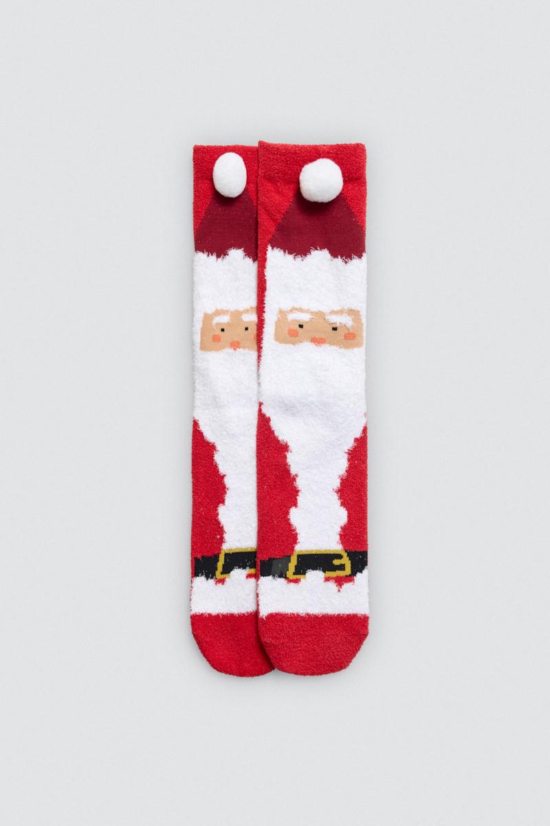 Par de meias macias vermelhas com desenho de Pai Natal e pompom branco.