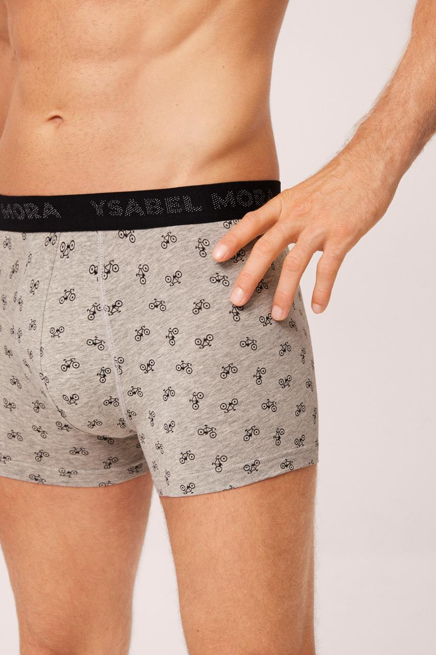 Cuecas cinza com padrão de bicicletas pretas e cós preto com texto