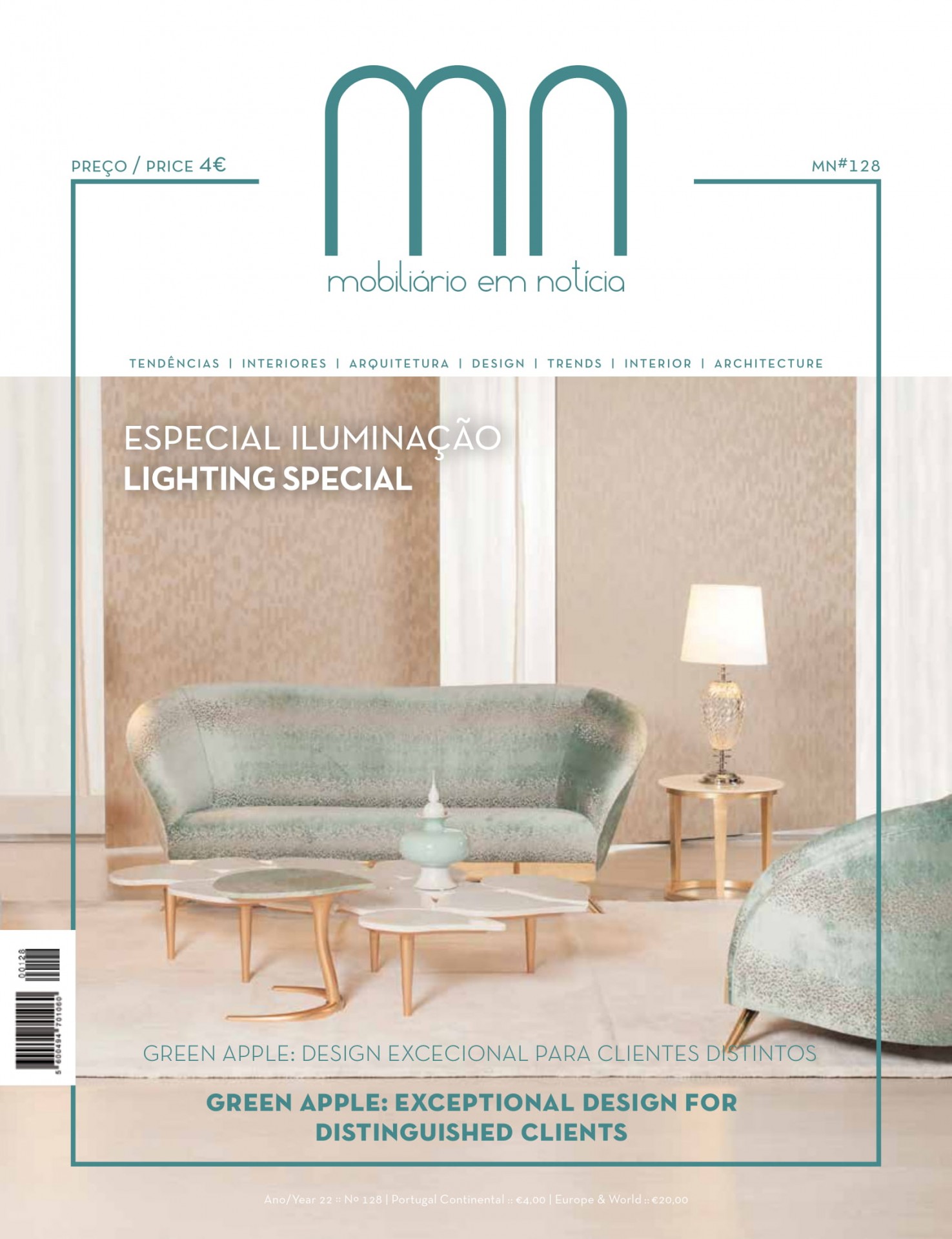 Revista mobiliário em notícia edição especial iluminação com sofá azul claro, mesa de centro e abajur numa sala