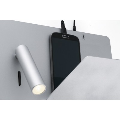 Painel cinza com luz LED, smartphone preto e objeto metálico prateado