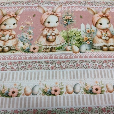 Tecido decorativo com coelhinhos e ovos em cores suaves