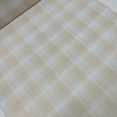 Tecido xadrez bege e branco sobre superfície branca