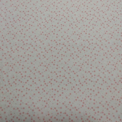 Tecido branco com pequenos círculos vermelhos repetidos em padrão