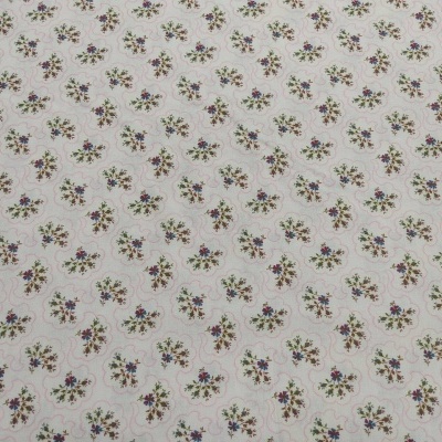 Tecido branco com padrão floral pequeno e repetitivo