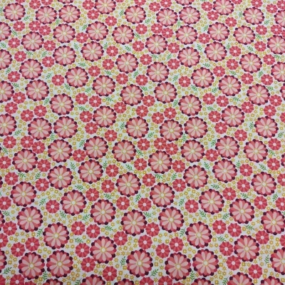 tecido com padrão floral em tons de rosa, vermelho, amarelo e verde