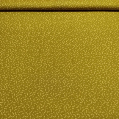 Rolo de tecido amarelo mostarda com padrão de ramos brancos