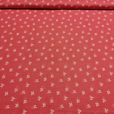 Tecido vermelho com pequenas flores brancas