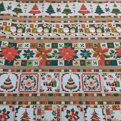 Tecido natalício com diversos padrões festivos em faixas horizontais