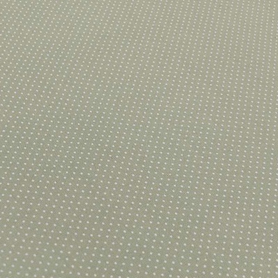 Tecido verde com padrão de pontos brancos