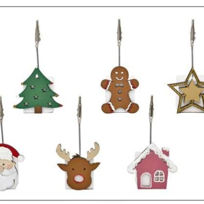Seis clips de metal com decorações natalícias coloridas, incluindo árvore, boneco de gengibre, estrela, Pai Natal, rena e casinha