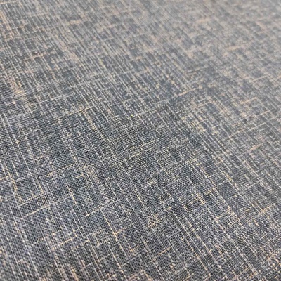 Tecido cinzento com padrão texturizado azul e bege