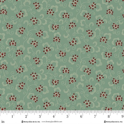 Tecido estampado verde-azulado com flores vermelhas e detalhes bege e régua abaixo