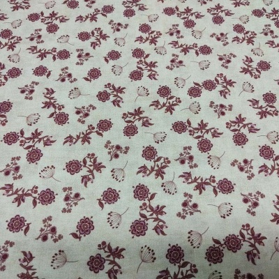 Tecido creme com padrão floral vinho e bege
