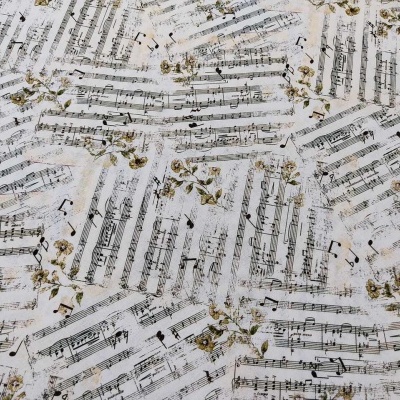 Papel com partituras musicais e padrão de folhas douradas