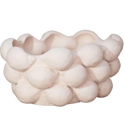 Vaso de cerâmica branca com textura de bolhas em relevo