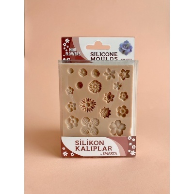Moldes de silicone com formas de flores pequenas em embalagem com texto